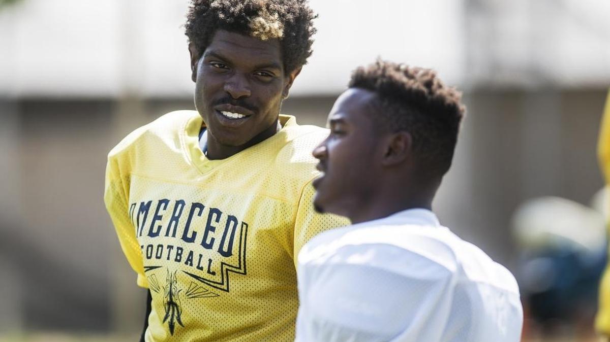 
Merced College freshman quarterback Randy Jones, left, talks with teammates during football practice at Merced College on Thursday. The Blue Devils play Yuba College at Stadium ’76 on Saturday.

