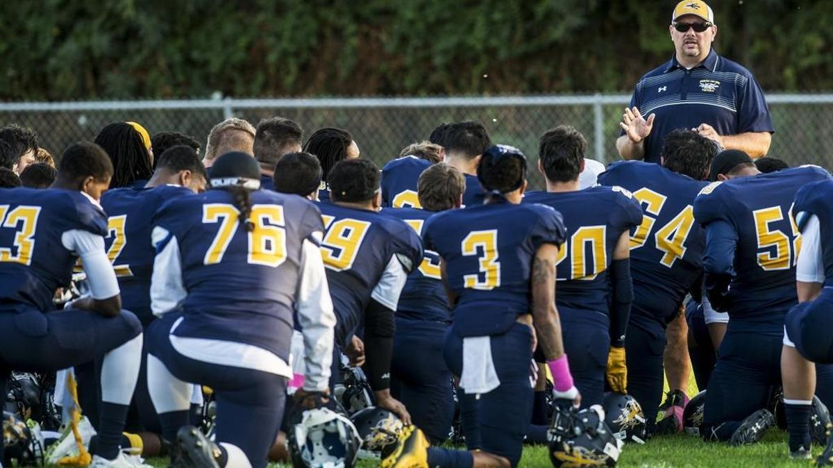 Blue Devils coach Bob Casey, before the Hartnell game, addresses his team, which has played inconsistently this season, especially in the red zone.