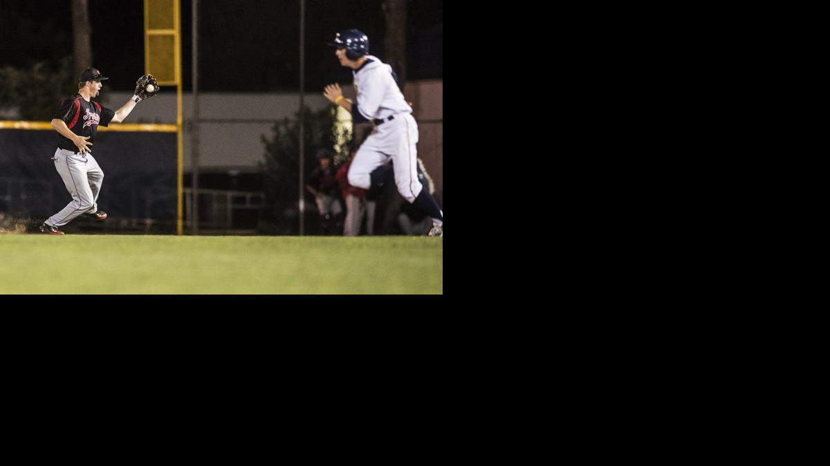 
Fresno City College freshman Matt Goertzen (11) snags a ground ball at second base during a game against Merced College at Blue Devil Diamond in Merced, Calif., Tuesday March 17, 2015. The Rams beat the Blue Devils 9-0.
