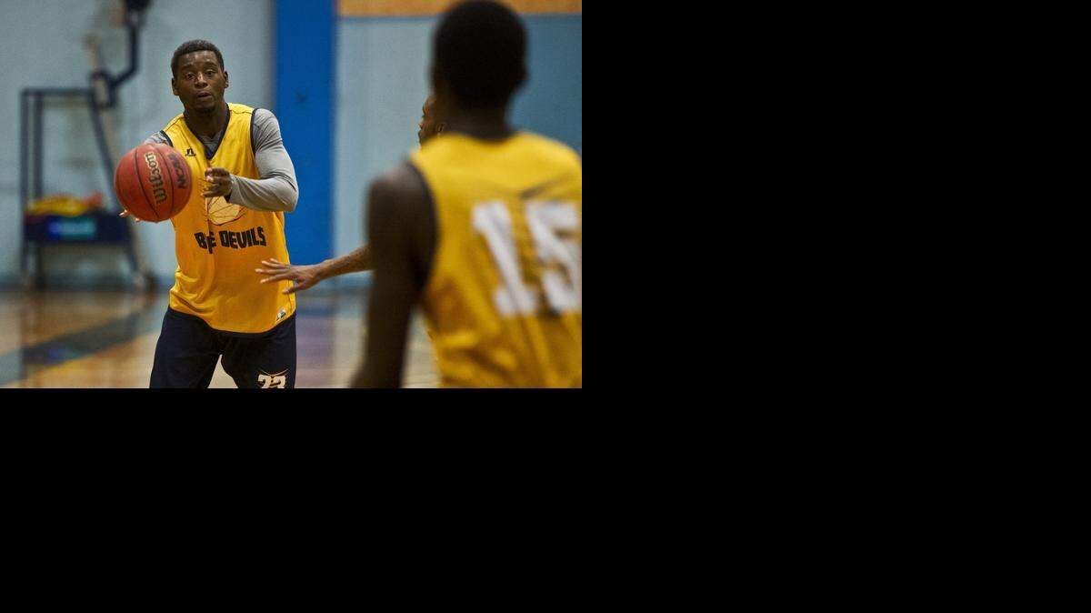 Merced College sophomore Jermaine Crowder passes to a teammate during practice. “We’ve worked hard ... to have the season of our lives,” he said.