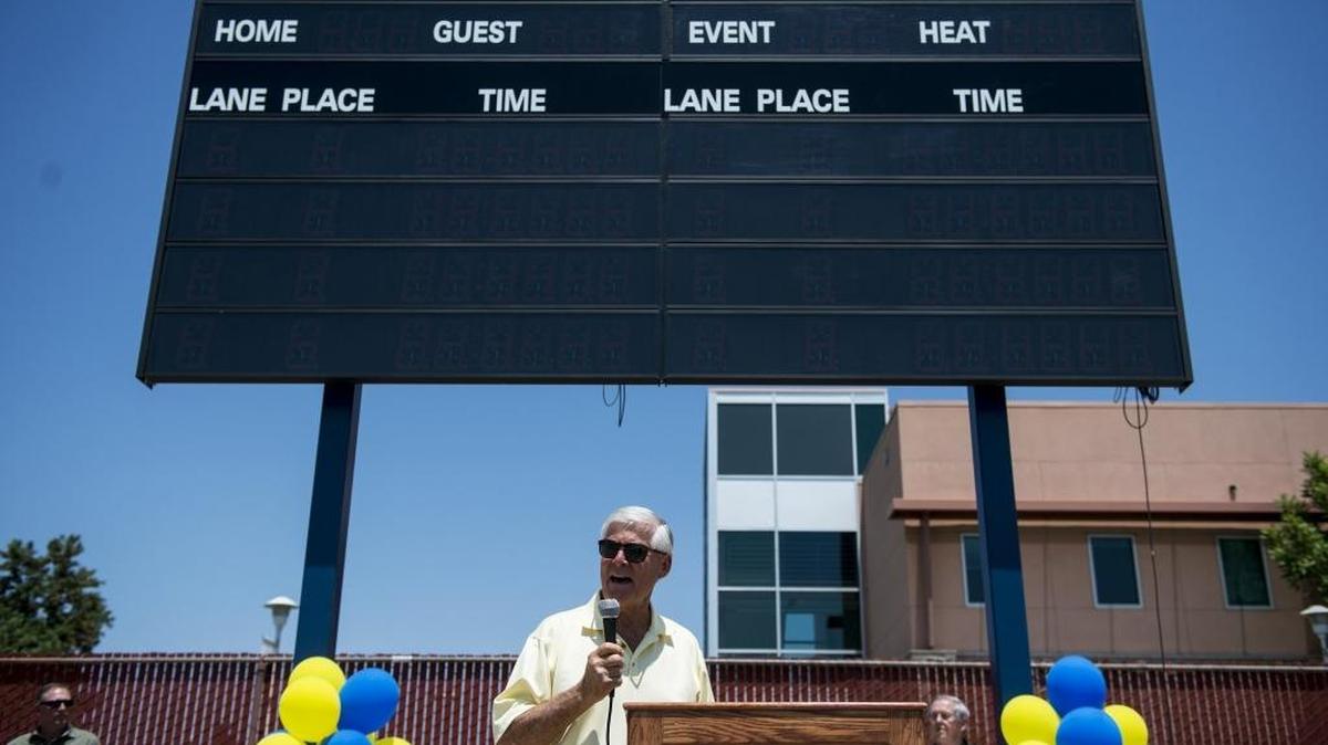Former Merced College water polo and swim coach Bob Pollitt, speaks to the crowd during a ceremony to rename the Merced College pool the Bob Pollitt Aquatic Center, in Merced, Calif., on Saturday, May 27, 2017. Pollitt is a member of the Blue Devils Hall of Fame.