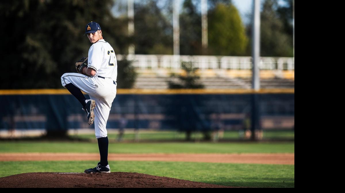 
Merced College freshman Blake Cederlind (27) winds up during a game against Fresno City College at Blue Devil Diamond in Merced in March. The Rams beat the Blue Devils 9-0. 
