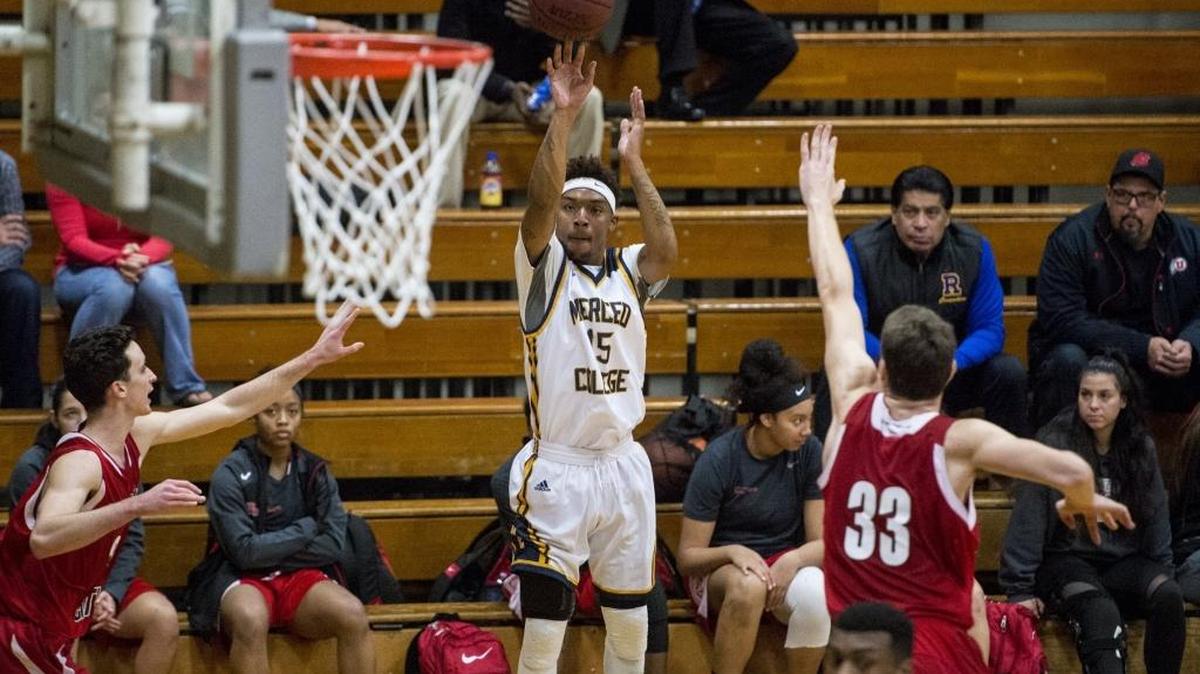 Merced College sophomore Anthony Nolen (15) makes a three pointer during a game against Fresno City College at Merced College in Merced, Calif., on Wednesday, Jan. 4, 2017.