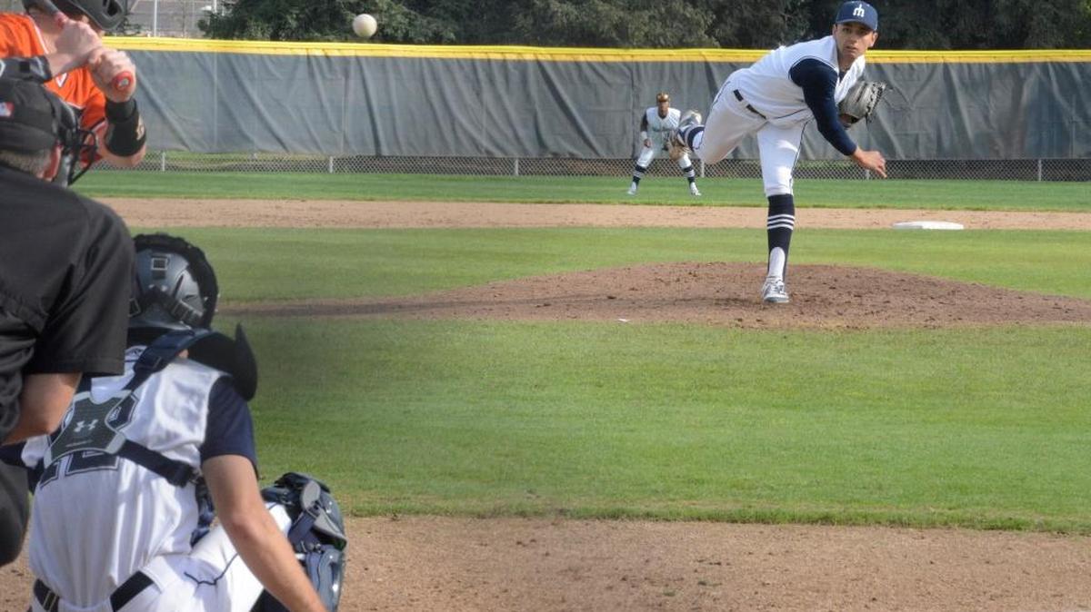 Merced College sophomore pitcher Nate McGhee, right, delivers a pitch in the fourth inning on Monday afternoon. McGhee only allowed one Lassen runner in six complete innings. Monday, Feb. 13, 2017 in Merced.
