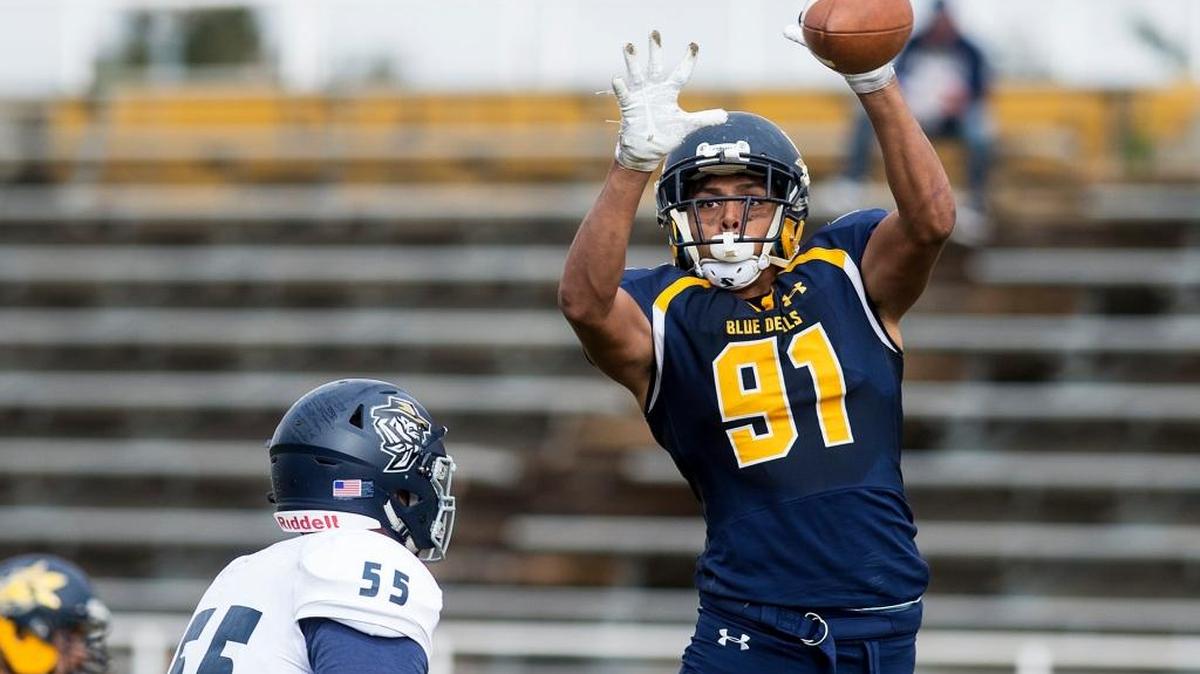 Merced College freshman David Perales (91) deflects a Yuba College pass attempt during a game at Stadium '76 in Merced, Calif., on Saturday, Nov. 4, 2017. The Blue Devils beat the 49ers 37-7.