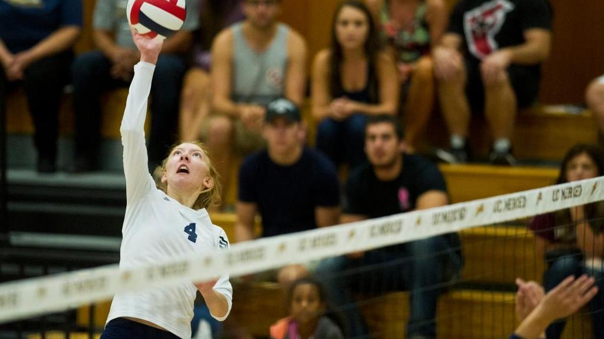 University of California, Merced freshman Rachael Schaefer taps the ball over the net during a game against Menlo College at the Joseph E. Gallo Recreation Center on the campus of UC Merced Saturday, Oct. 4, 2014. The Bobcats beat the Oaks 3-0.