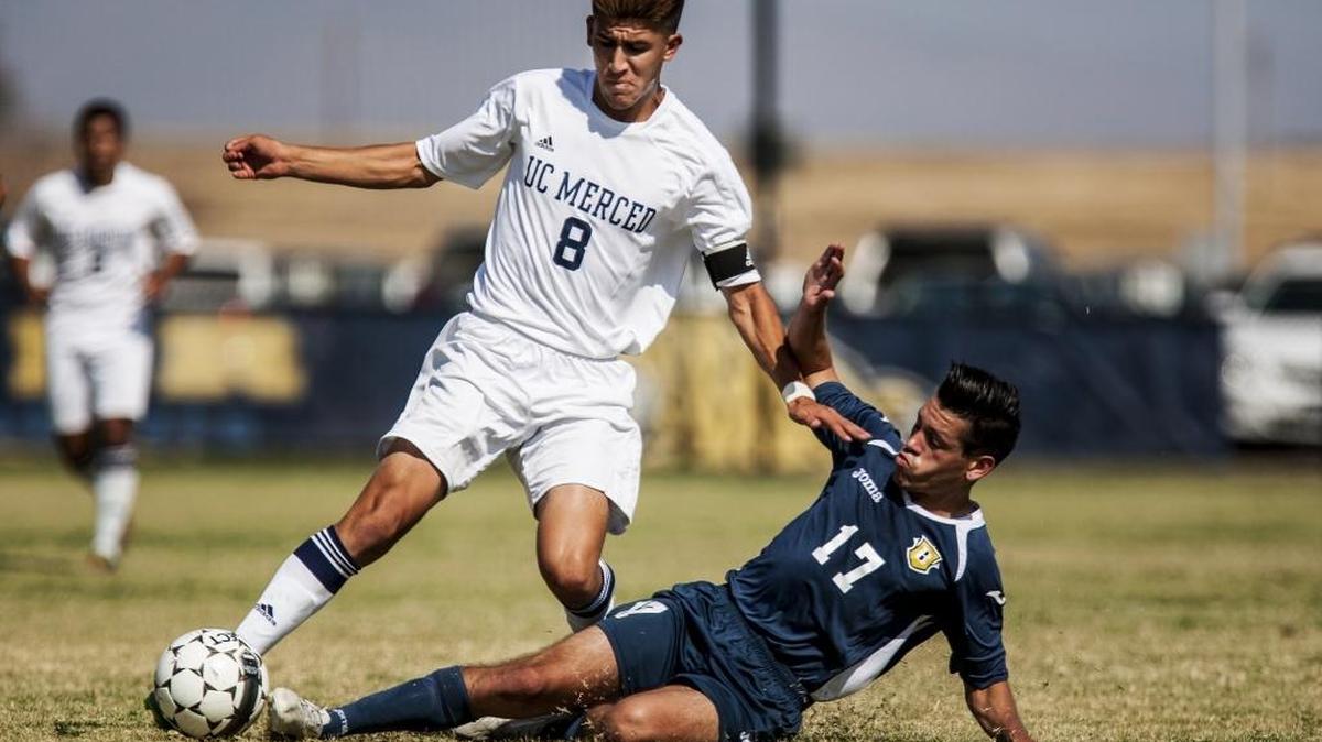 
Bethesda's Richard Mendez (17) steals the ball from University of California, Merced sophomore Marco Torralva (8) during a game at Lake Field on the campus of UC Merced in Merced, Calif., Tuesday, Sept. 1, 2015. The Bobcats beat the Flames 5-0.
