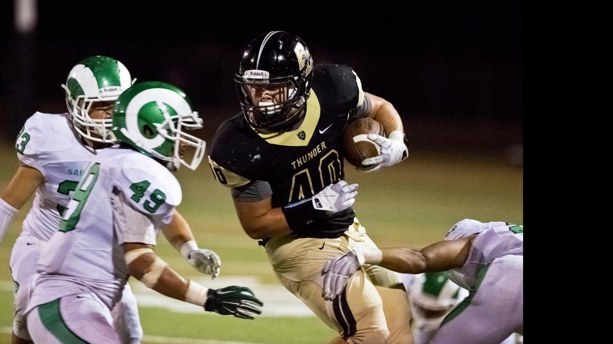 
Buhach Colony senior running back Justin Stefani fights his way through St. Mary’s tacklers during a game at Atwater High School in Atwater, Calif., on Friday, Oct. 3, 2014. St. Mary’s of Stockton beat Buhach Colony 45-30.
