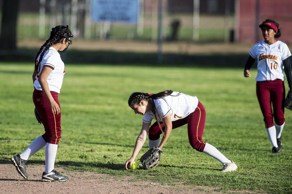 Golden Valley sophomore Brandy Colomer (7) fields a ground ball on the edge of the infield during a game against Merced at Joe Herb Park in Merced Calif., on Thursday, April 12, 2018. The Cougars beat the Bears 3-2.