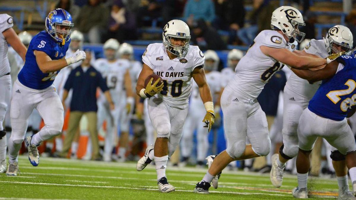 Ulonzo Gilliam runs the ball against San Jose State in the season opener for UC Davis. Gilliam scored three touchdowns in his college debut against the Spartans.