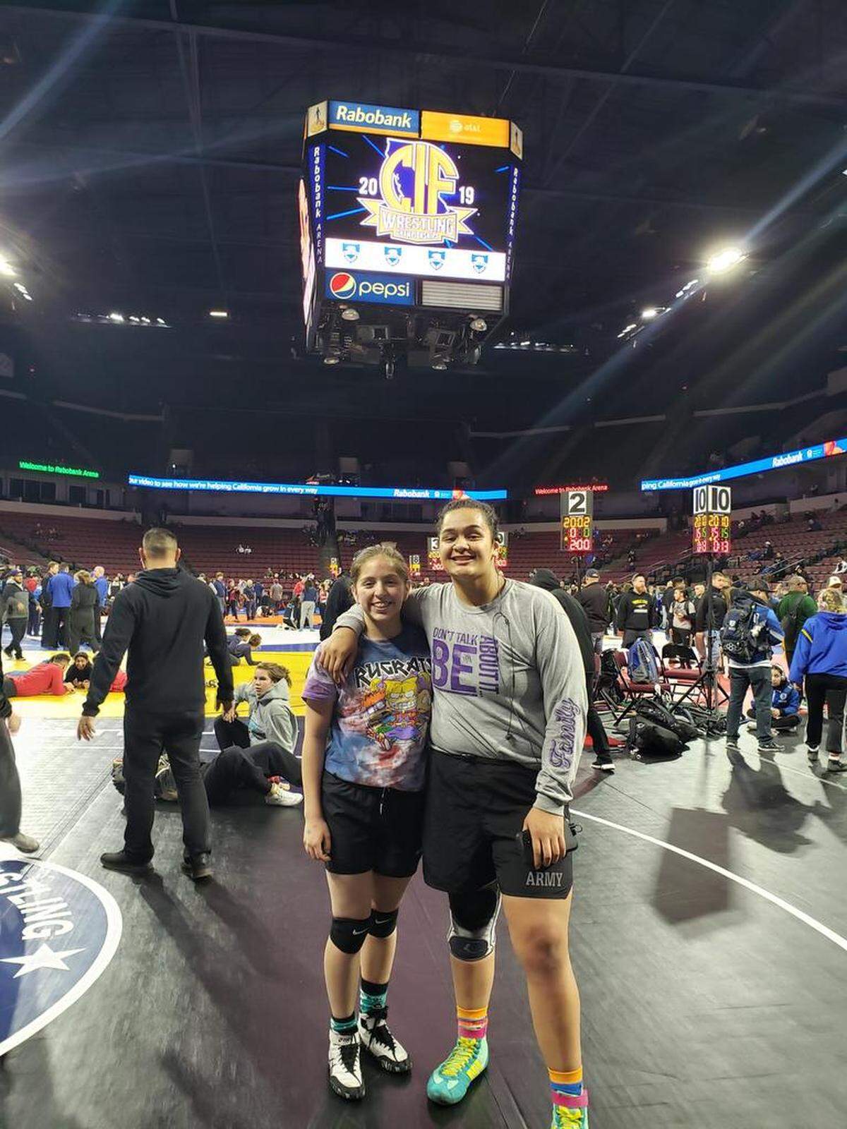 Pacheco High senior Tagivale Vaifale (right) poses for a picture with teammate Leonor Del Rio at the CIF State Meet at Rabobank Arena in Bakersfield. Vaifale finished third and is the Sun-Star Girls Wrestler of the Year.