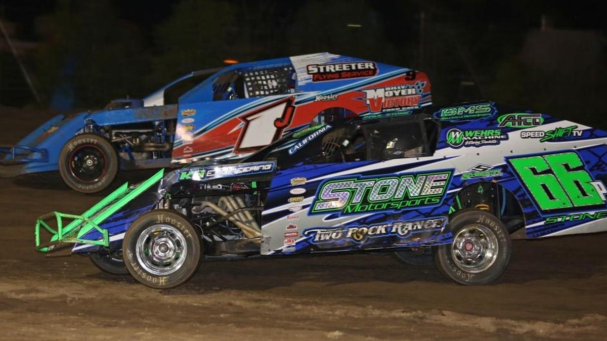 Merced Speedway - Jeff Streeter (1J) and Paul Stone duel for the lead of the IMCA Modified Stock car feature event at Merced Speedway. (Mike Adaskaveg Photo)