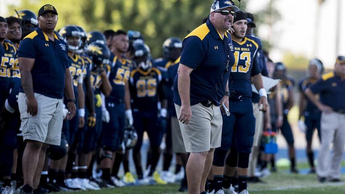 Merced College head coach Bob Casey calls out to his players during a game against De Anza College at Stadium ’76 in Merced, Calif., on Saturday, Sept. 8, 2018. De Anza beat the Blue Devils 29-27.