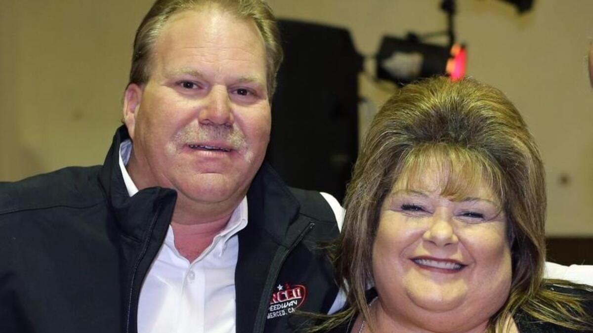 After a successful first season as promoter, the late Ed Parker, left, honored Margie Mejia of Atwater, right,  at Merced Speedway's Awards banquet. Mejia is credited with the rebirth of the free Independence Day races and fireworks three years ago. The program will go on as scheduled this Saturday night.  Photo by  Mike Adaskaveg.
