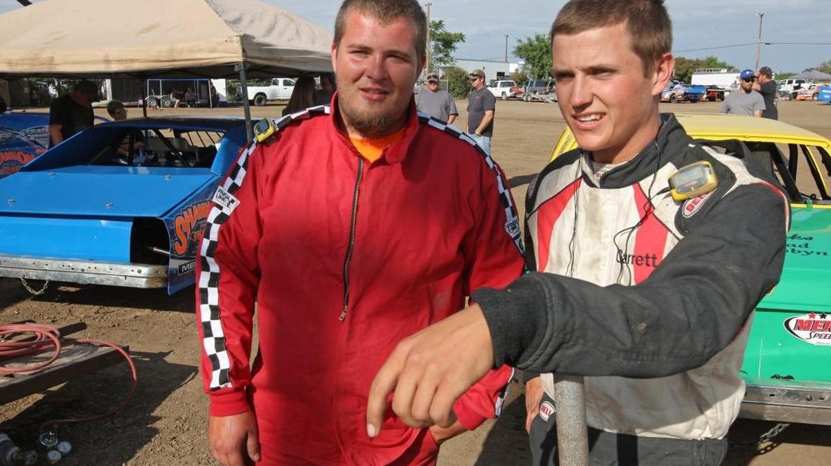 (050617 Oakley, CA) Merced Speedway - Kodie Dean, left, and Garrett Corn, right, discuss the upcoming night's races while in the pits at Merced Speedway. The friendly foes park next to each other and work on each others cars. Saturday, May 06, 2017. Staff photo by Mike Adaskaveg.
