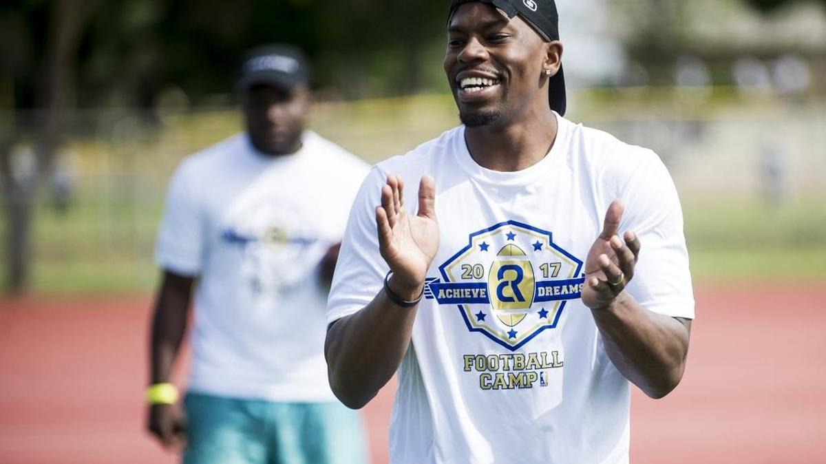 Golden Valley High School graduate and Canadian Football League player Chris Randle, cheers on youth football players during the Chris Randle's Achieve Dreams Youth Football Camp at Golden Valley High School in Merced, Calif., on Saturday, May 6, 2017. Randle graduated from Golden Valley High School in 2007. After playing four years of football at Utah State, he spent a short time with the Dallas Cowboys. Randle has played the past six years in the Canadian Football League. Over 100 children participated in the morning session for the 7-12 age group Saturday morning.