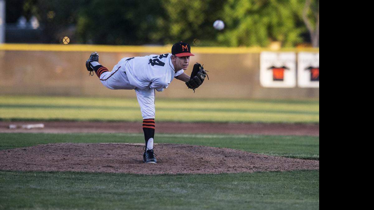 
Merced senior Mitchell Miller (24) delivers a pitch during a game against Buhach Colony at Merced High School in Merced, Calif., Friday, April 17, 2015.
