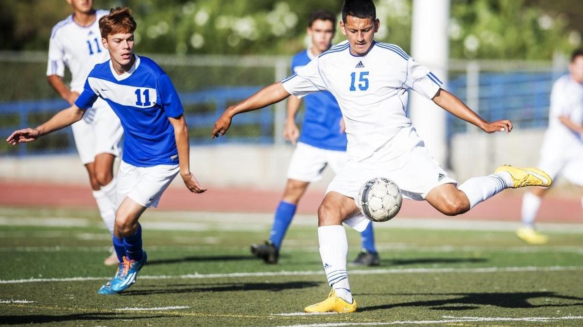 
Atwater senior Christian Olguin (15) plays the ball forward during a game against Turlock at Atwater High School in Atwater, Calif., Tuesday, Sept. 15, 2015. The Falcons beat the Bulldogs 6-0.
