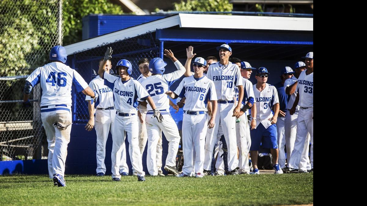 The Atwater dugout cheers after the Falcons score two runs against Buhach Colony on Tuesday in Atwater.
