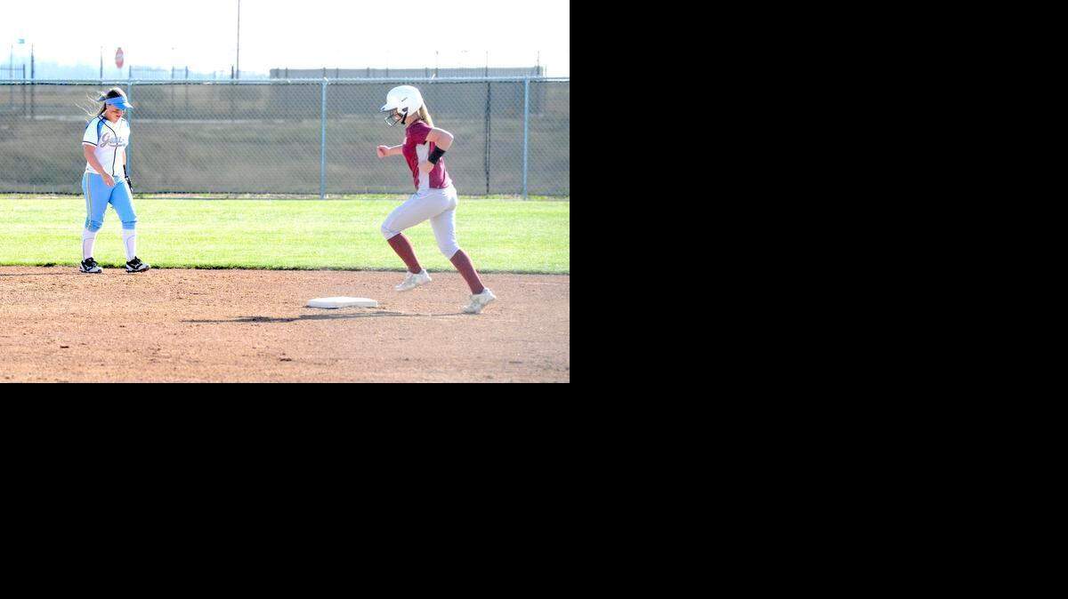 
Los Banos' Ali Waltman, right, circles second base after blasting a two-run home run in the third inning.
