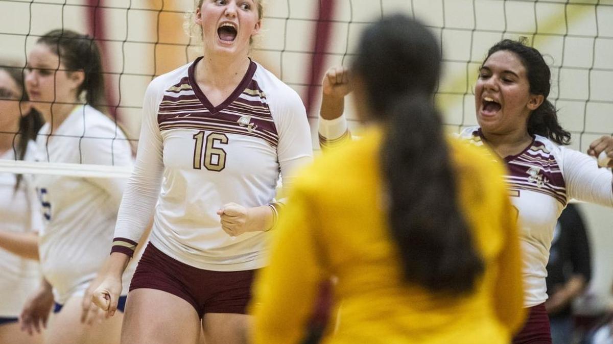 
Golden Valley junior Abbee Croninger (16) yells while celebrating a Cougar point with her teammates during a match against Madera at Golden Valley High School in Merced, Calif., Thursday, Sept. 3, 2015. The Cougars beat the Coyotes 3-2.

