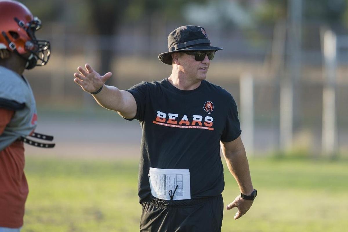Merced head coach Rob Scheidt speaks to players during football practice at Merced High School in Merced, Calif., on Wednesday, Aug. 1, 2018.