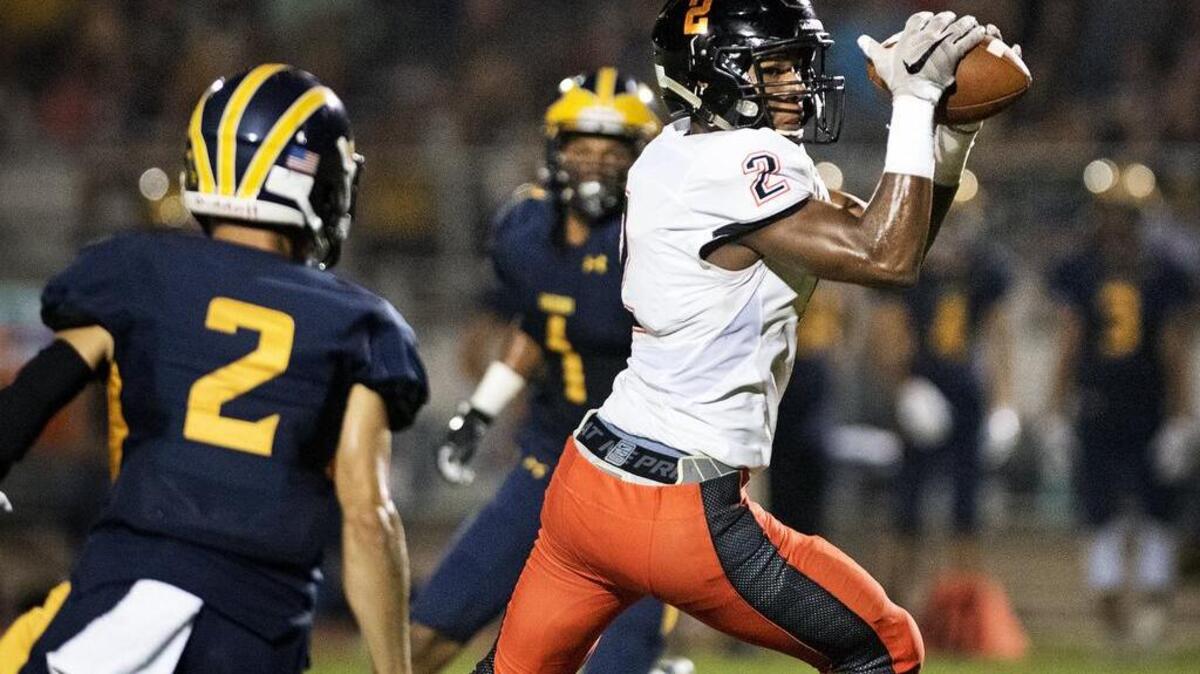 Merced High receiver Xavier Stewart catches a pass against Gregori last week. The Bears are off to an 0-2 start this season.