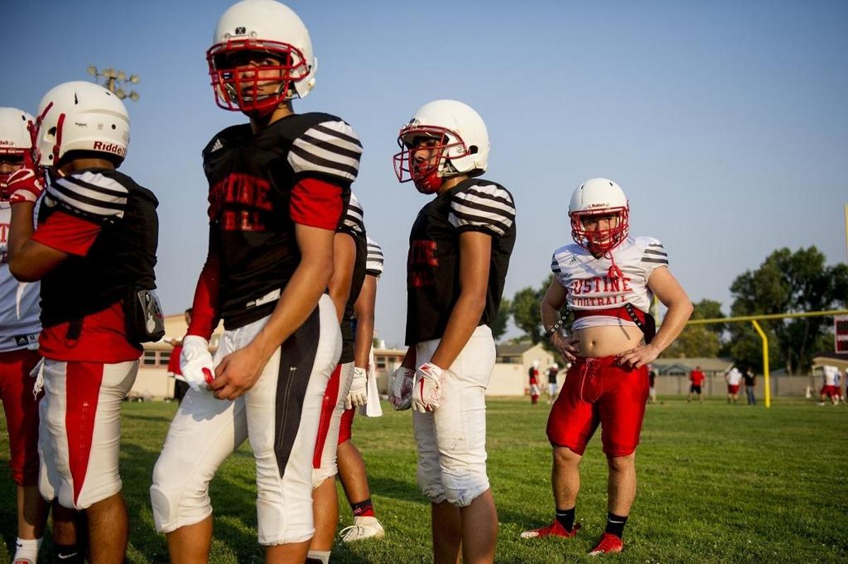 Gustine’s Brandon Garbez, right, lines up to practice route running during football practice at Gustine High School in Gustine, Calif., on Thursday, Aug. 9, 2018.