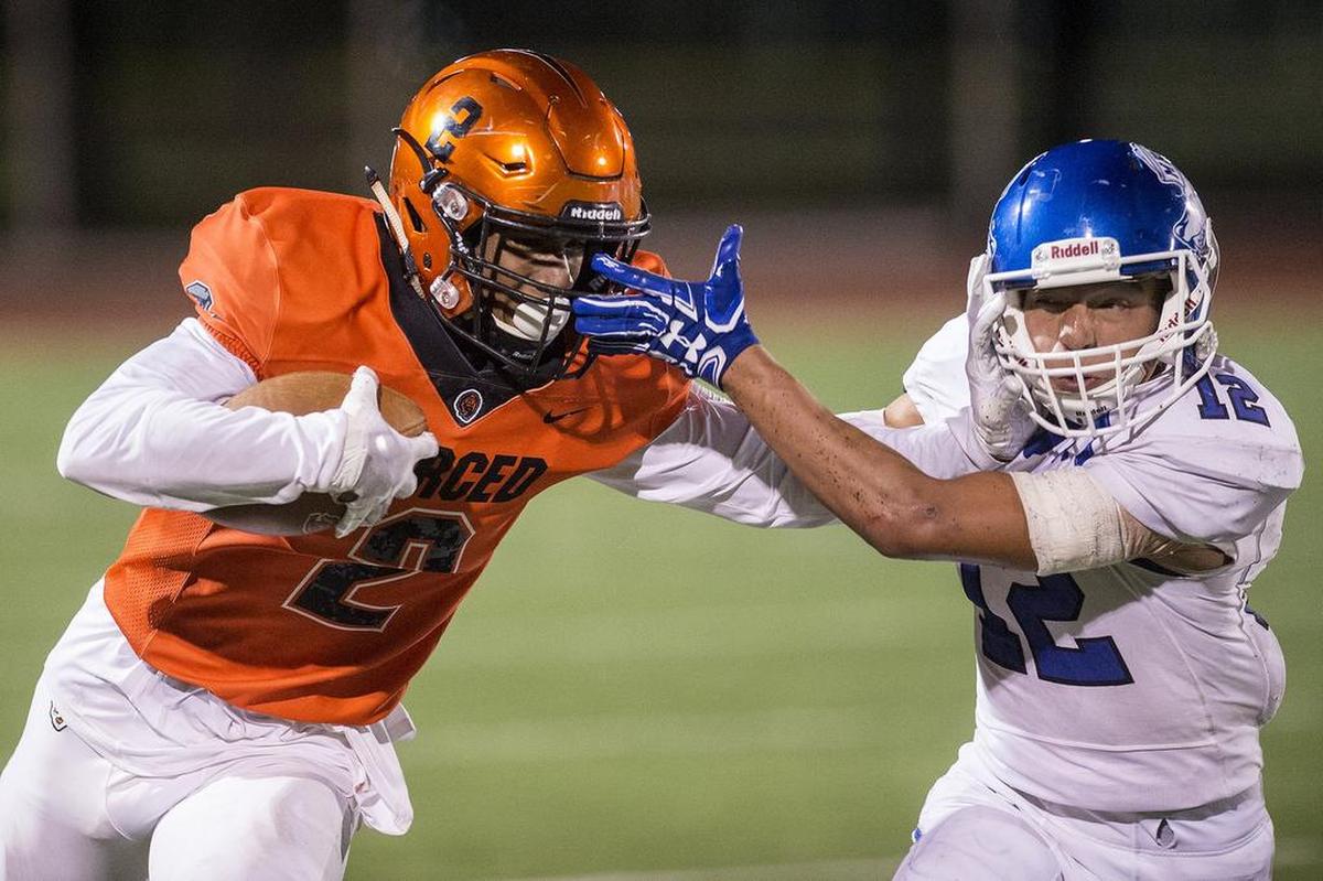 Merced senior Xavier Stewart (2) carries the ball up the sideline during a game against Madera at Veterans Stadium on the campus of Golden Valley High School in Merced, Calif., on Friday, Sept. 7, 2018. The Bears beat the Coyotes 63-35.
