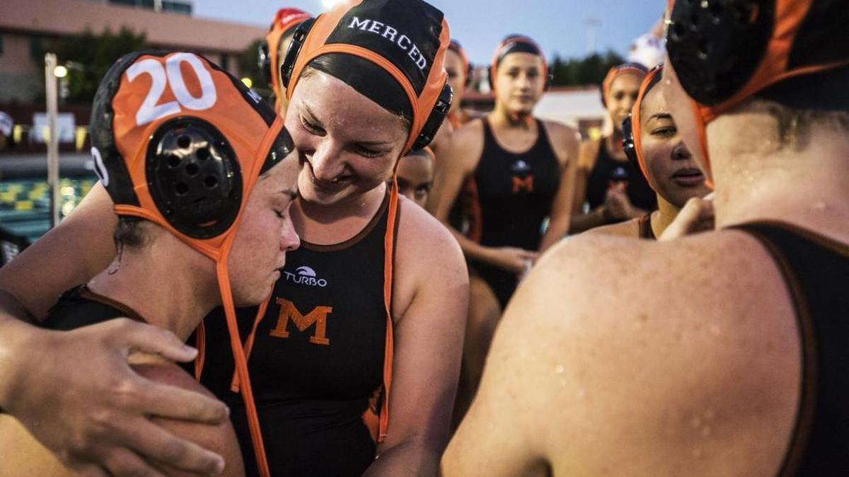 Merced senior Kathryn Elgin, second from left, hugs junior teammate Stephanie Hart, left, following a 9-4 win over Golden Valley at Merced College in Merced, Calif., Thursday, Oct. 29, 2015.