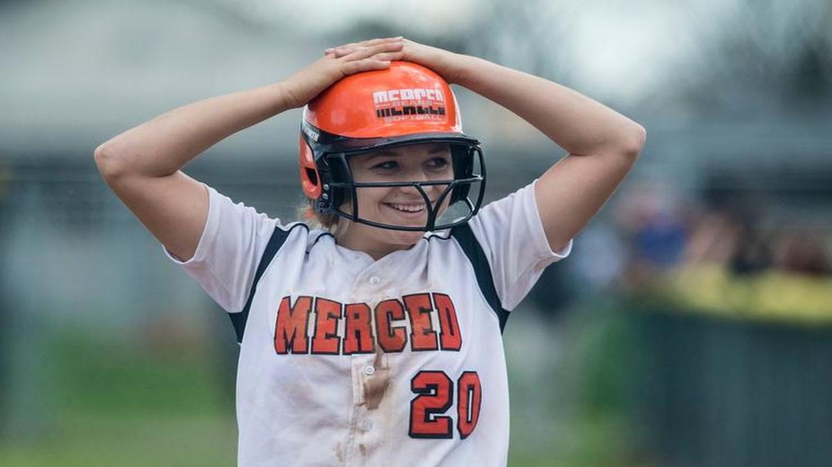 
Merced junior Rheanne Lewis smiles to the dugout during a game against Los Banos at Merced High School in Merced in February. Wearing a No. 1 jersey, Lewis hit the first pitch she saw for a home run over the left-field fence to ignite a three-run first inning for the fifth-seeded Bears in a game against Rodriguez on Wednesday.
