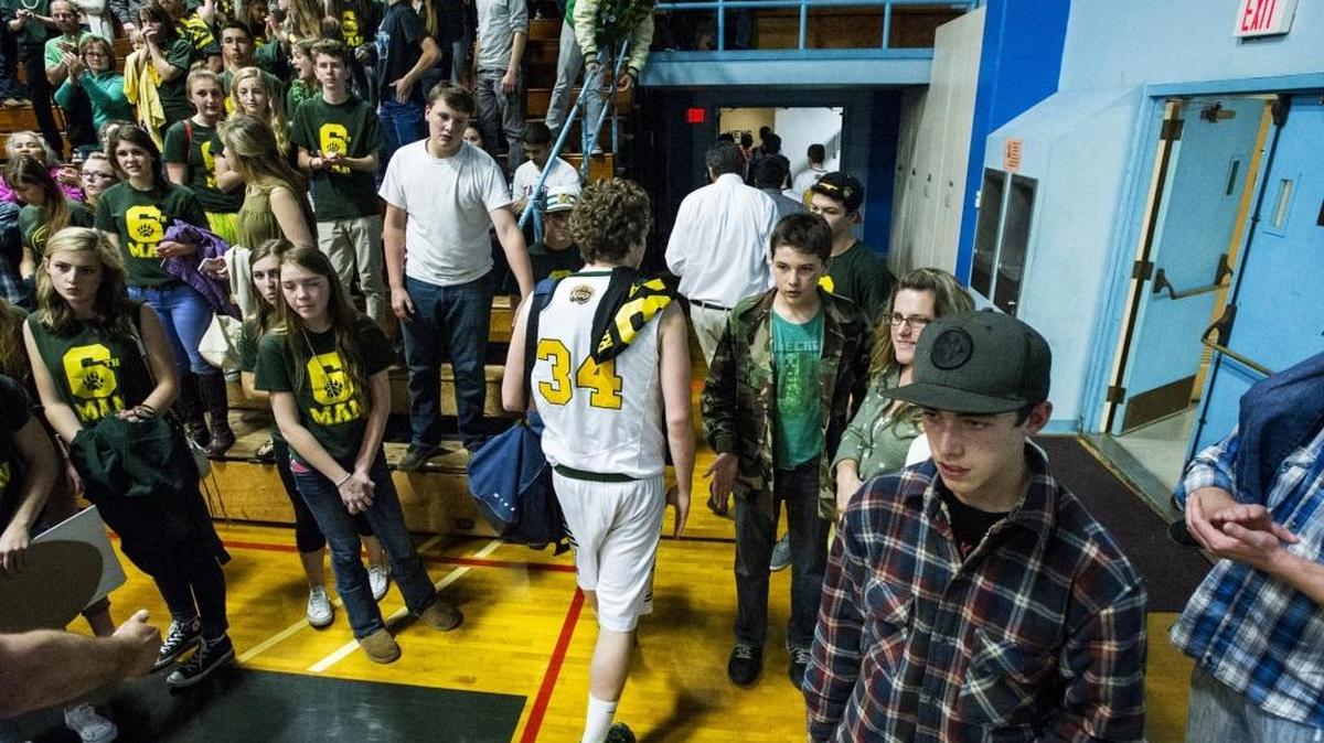 The Mariposa basketball team walks to the locker room following a 70-65 loss to the Stuart Hall Knights in the NorCal playoffs at Merced College in Merced, Calif., Saturday, March 12, 2016. The Knights beat the Grizzlies 70-65.
