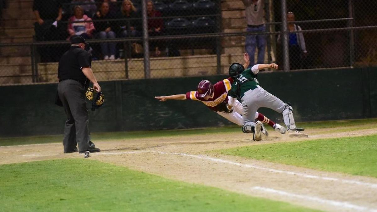 Trent Mallonee, left, makes a valiant effort with a dive, but is tagged out at the plate by Colfax catcher John Pantlick for the game's final out. The top-seeded Tigers were upset by No. 9 Colfax 3-2 on Thursday night. Thursday, May 18, 2017 in Lodi.