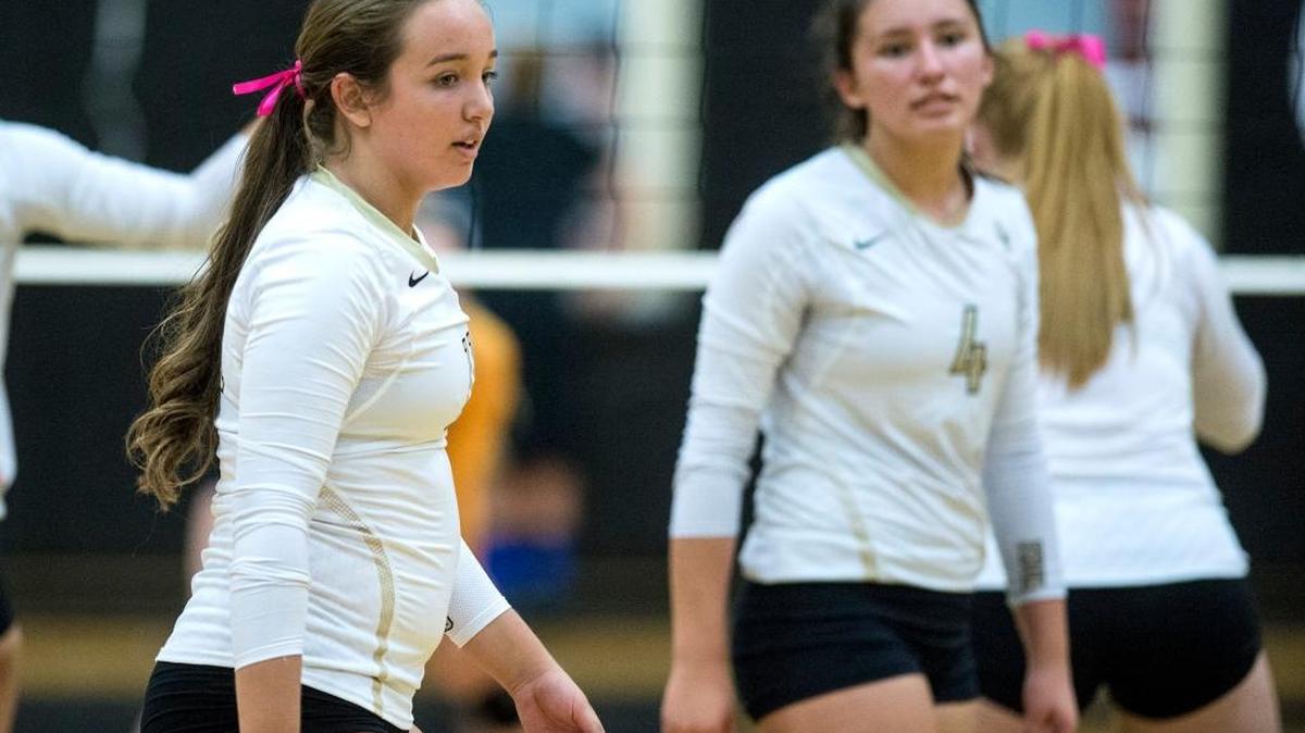 Buhach Colony junior Mallory Pazin (11), left, prepares for the start of game against El Capitan earlier this season. Pazin was named the Central California Conference Setter of the Year.