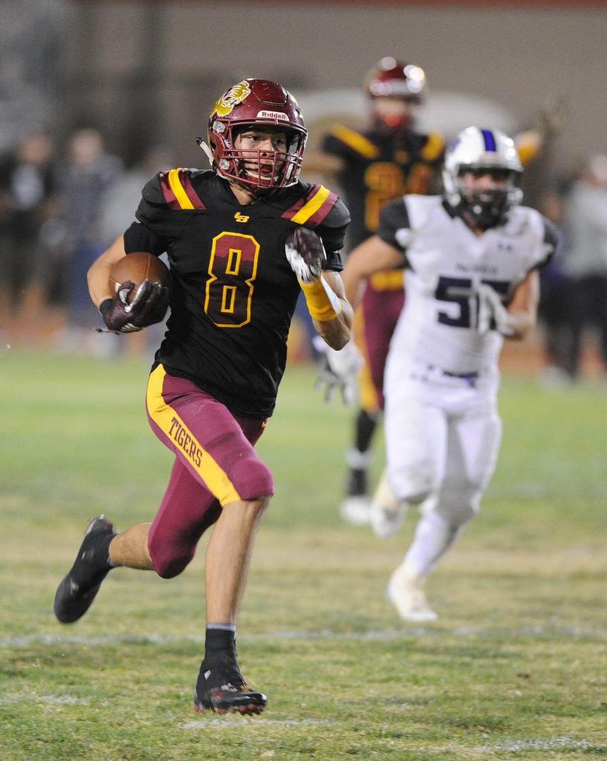 Los Banos wide receiver, Landon Ramos, scores the decisive touchdown on a 70-yard pass reception from Dasani Tate in fourth quarter to give Los Banos the final score of 28-21 Fri., Oct. 26, 2018 at Loftin Stadium.