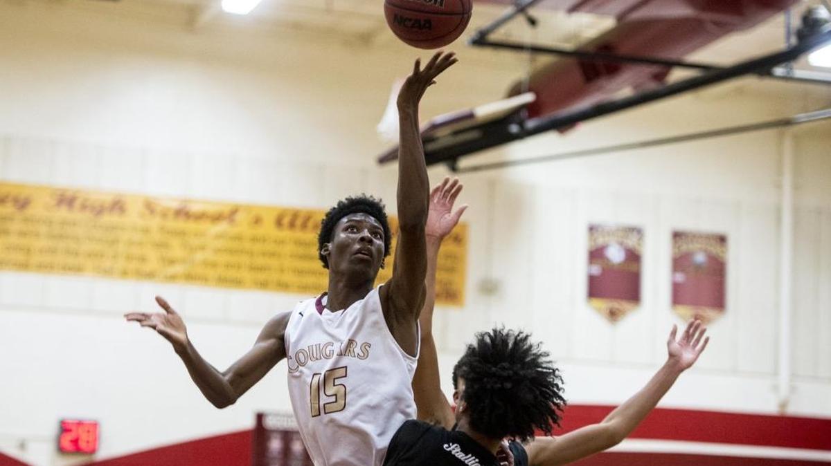 Golden Valley junior Cyrus Allen (15) attempts a layup during a game against Madera South at Golden Valley High School in Merced, Calif., on Thursday, Dec. 22, 2016. The Stallions beat the Cougars 60-51.