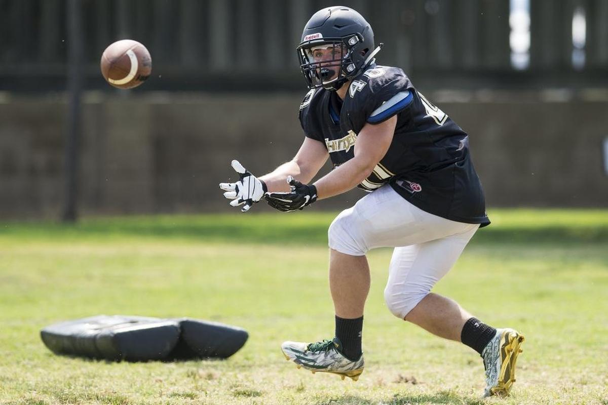 Buhach Colony’s Owen Thomas catches a pass during football practice at Buhach Colony High School in Atwater, Calif., on Tuesday, July 31, 2018.