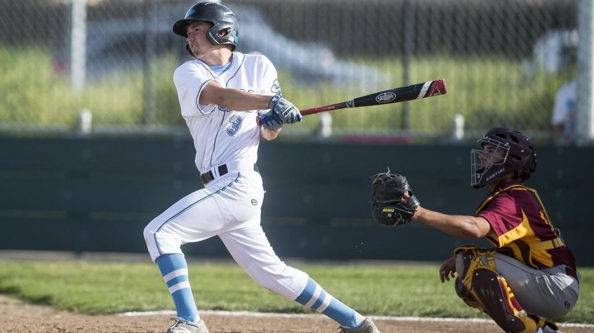 El Capitan senior first baseman Jacob Pilkington (3) connects with a pitch during a game against Los Banos at El Capitan High School in Merced, Calif., Wednesday, April 6, 2016. The Gauchos beat the Tigers 5-4.