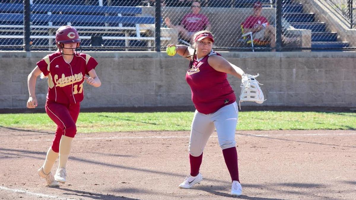 Los Banos first baseman Savannah West, right, cocks to throw to first after fielding a sacrifice bunt. Saturday, May 20, 2017 in Stockton.