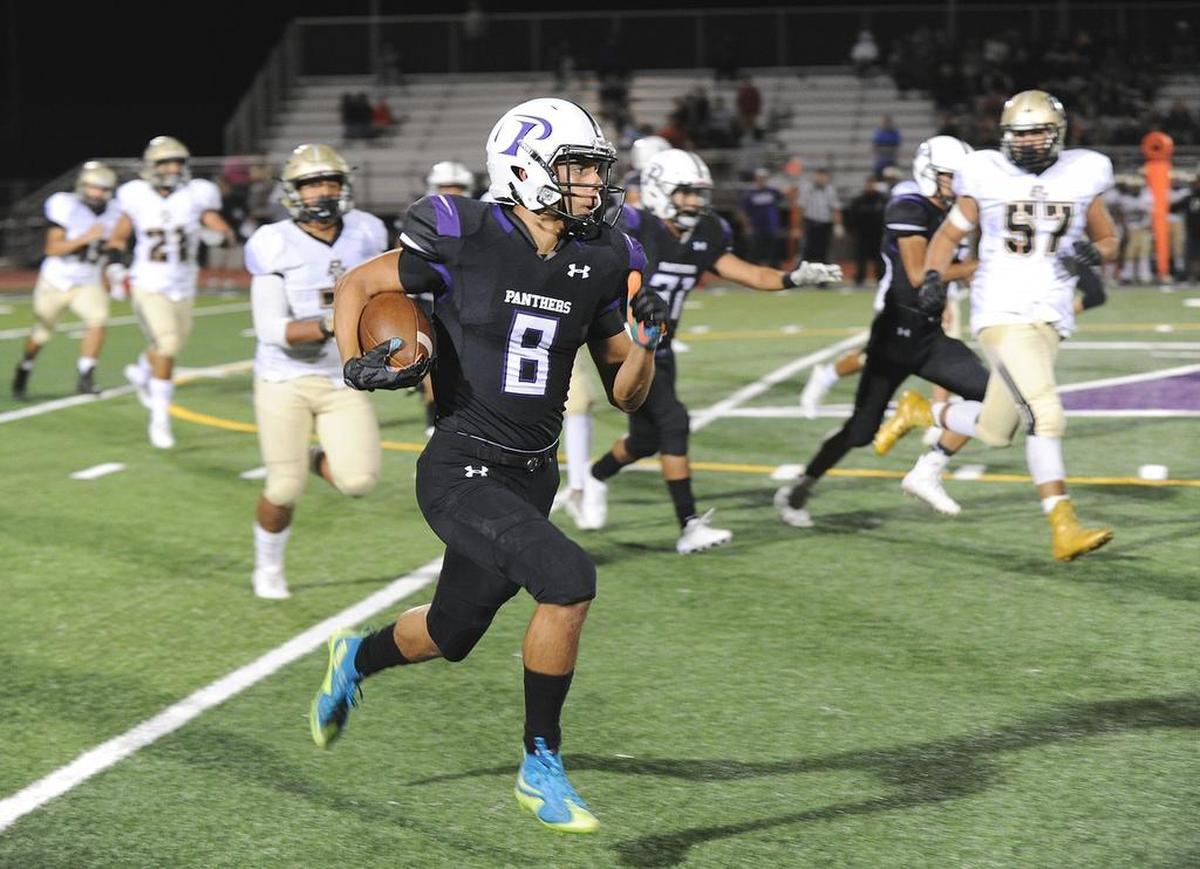 Pacheco High tight end, Marcus Ordunez runs up field in the fourth quarter against Buhach Colony Fri., Sept. 15, 2017 at Veterans Stadium in Los Banos.