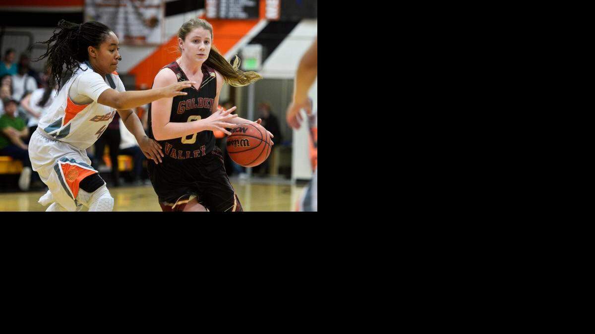 
Golden Valley freshman Delia Moore, right, drives the lane against Merced junior Lexi Thompson during a game at Merced High on Jan. 22. Golden Valley earned the No. 7 seed in Division II and a home game in the Sac-Joaquin Section playoffs.
