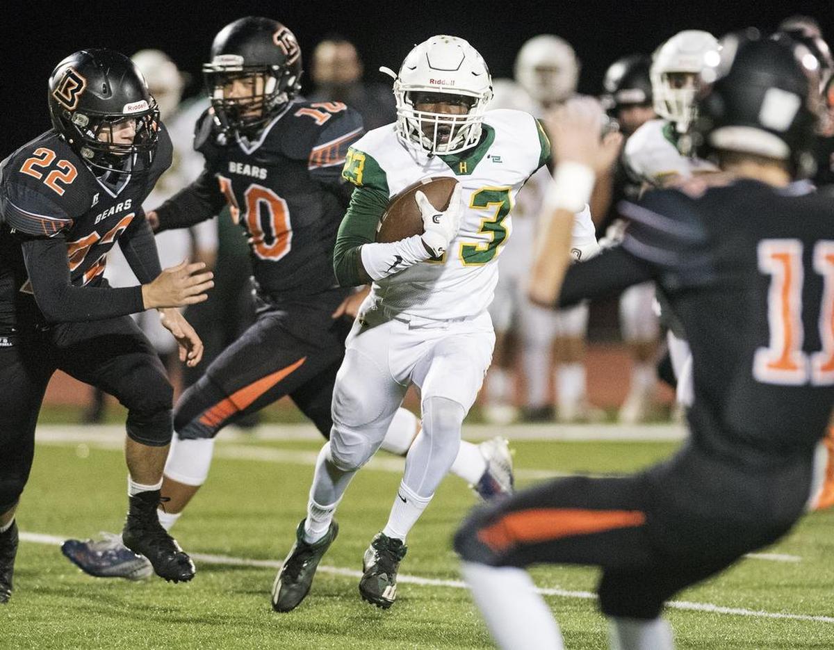 Hilmar runningback Isaac Sharp runs for a 42-yard touchdown run in the first quarter during the first round Division 5 Sac-Joaquin playoff game with Summerville in Summerville, Calif., on Friday, Nov. 10, 2017.