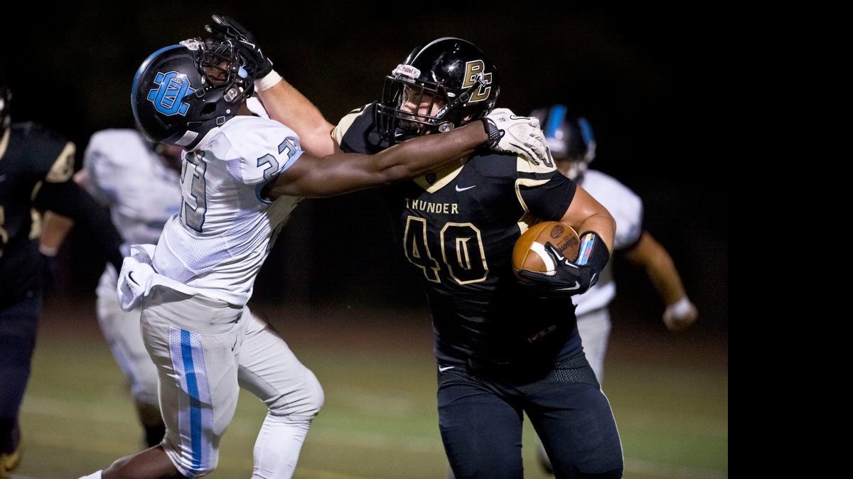 
Buhach Colony’s Justin Stefani, stiff-arming Clovis North’s Bransin Johnson last season, will play fullback at Merced College next season.
