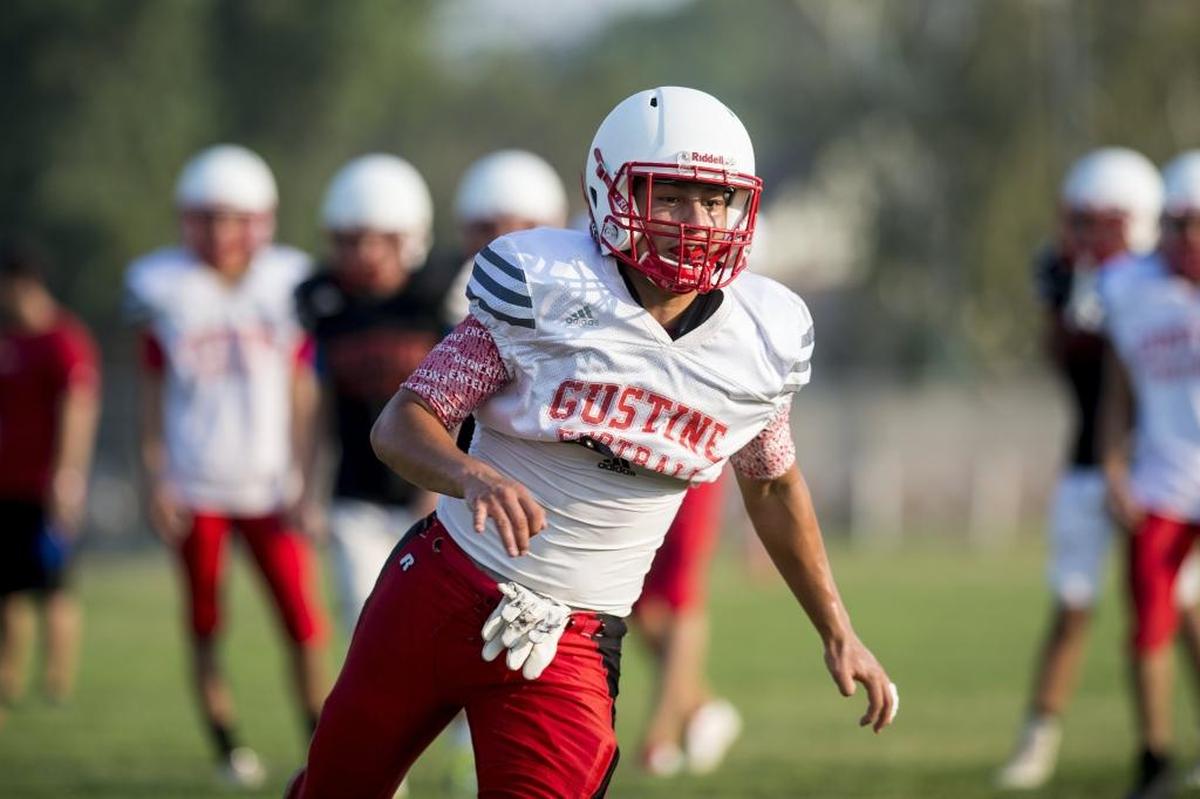 Gustine’s Daniel Ibarra runs a route during football practice at Gustine High School in Gustine, Calif., on Thursday, Aug. 9, 2018.
