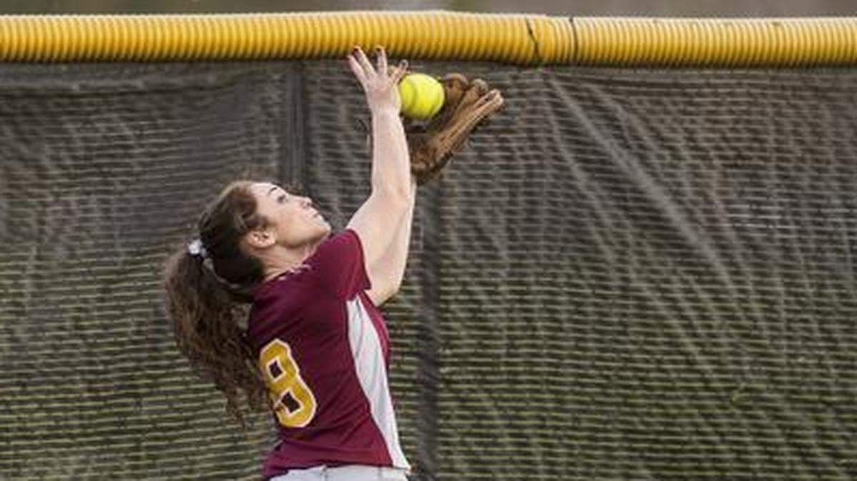 
Los Banos senior Kailyn Neves (8) catches a fly ball in the outfield during a game against Merced at Merced High School in Merced, Calif., Friday, Feb. 27, 2015. The Bears beat the Tigers 10-0 in six innings.
