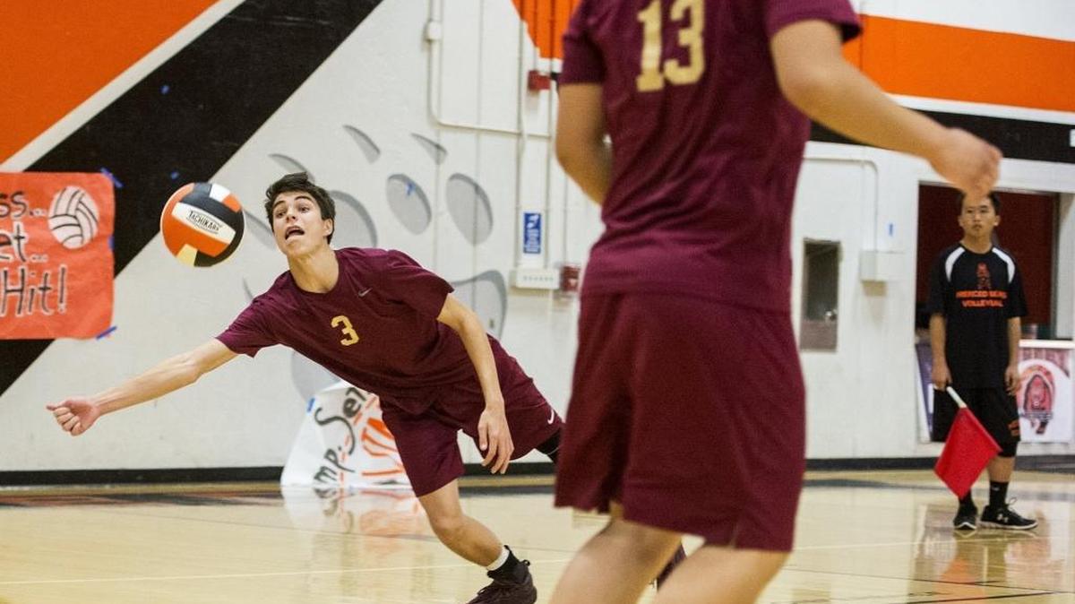 Golden Valley sophomore Bryan Livesay (3) dives for the ball during a volleyball match against Merced at Merced High School in Merced, Calif., on Tuesday, March 14, 2017. Livesay was a force on offense and defense for the Cougars this season and is the Sun-Star Boys Volleyball Player of the Year.