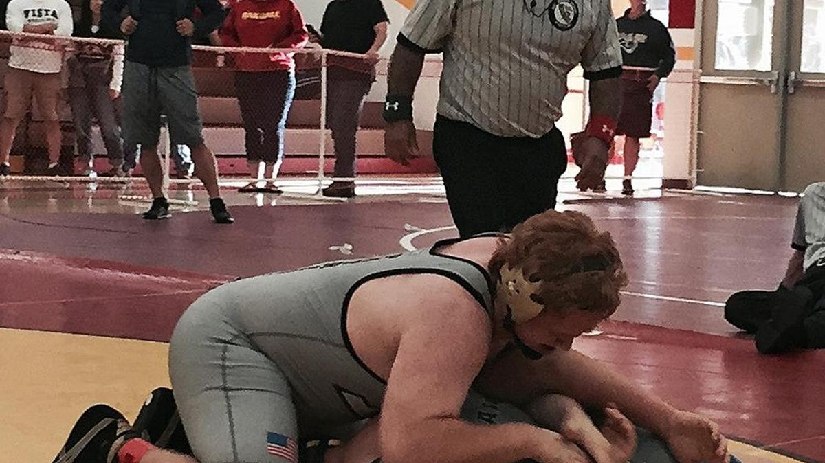 Adam Cuestas, a wrestling official who worked the Sac-Joaquin Section Division III Tournament on Saturday, Feb. 20, in Oakdale, Calif., keeps a watchful eye on the wrestlers.
