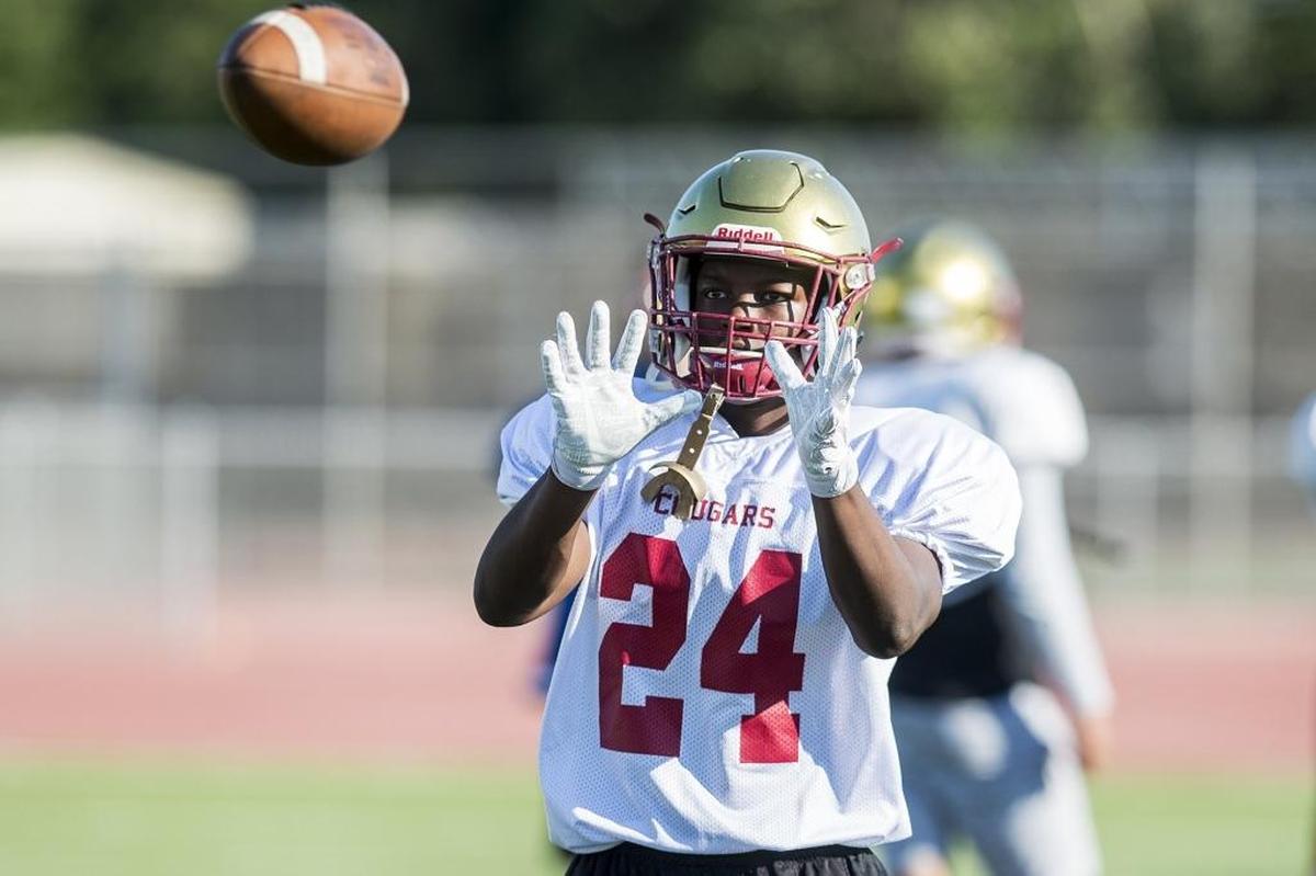 Golden Valley’s Jaren Phillips catches a pass during football practice at Golden Valley High School in Merced, Calif., on Wednesday, Aug. 1, 2018.