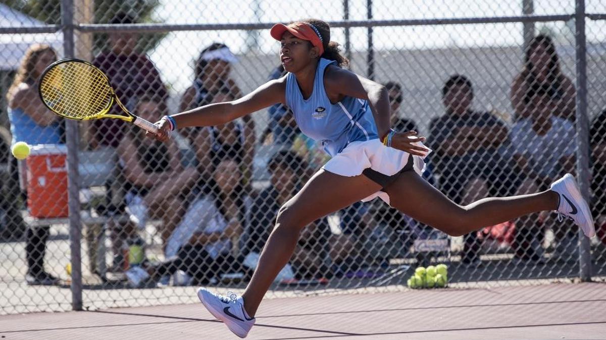 El Capitan's Jenasis Yarrell attempts to chase down a shot by Golden Valley's Chadue Lee during a Central California Conference singles final match at Buhach Colony High School in Atwater, Calif., on Thursday, Oct. 26, 2017.