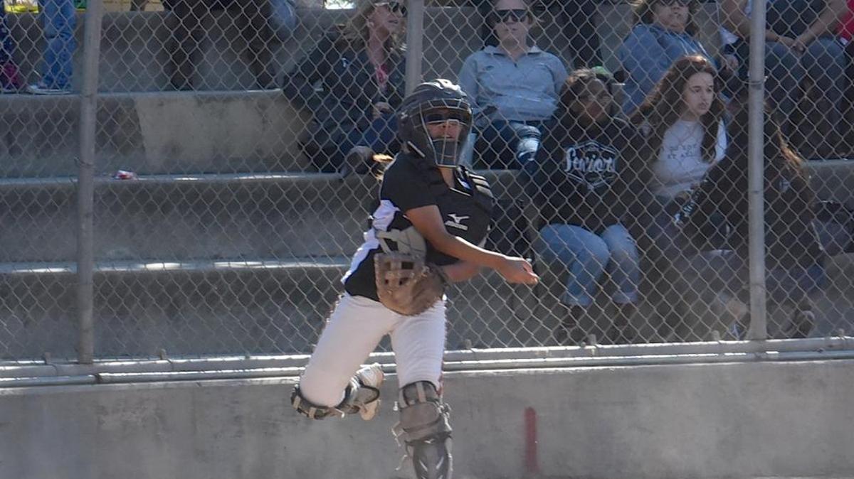 Merced catcher Alazaya Landeros fires to first base after a dropped third strike. The sophomore got Merced’s seventh-inning rally going with an RBI double Monday, April 25, 2016, in Merced.